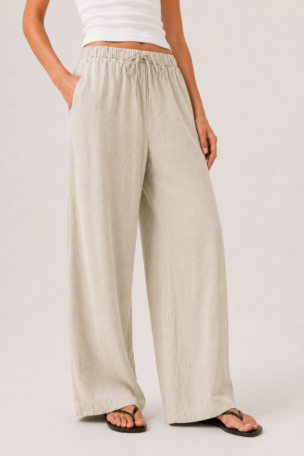 Light beige pull-on pants with elastic waistband and flowing wide legs