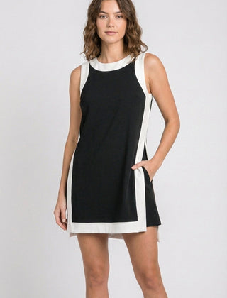 Black sleeveless dress with white trim and side stripe detail