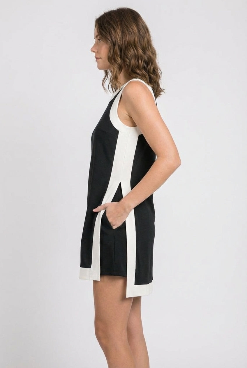 Black sleeveless dress with white side stripe and keyhole back detail
