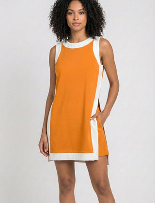 Orange sleeveless tunic dress with white crew neck and hem trim, side tie detail