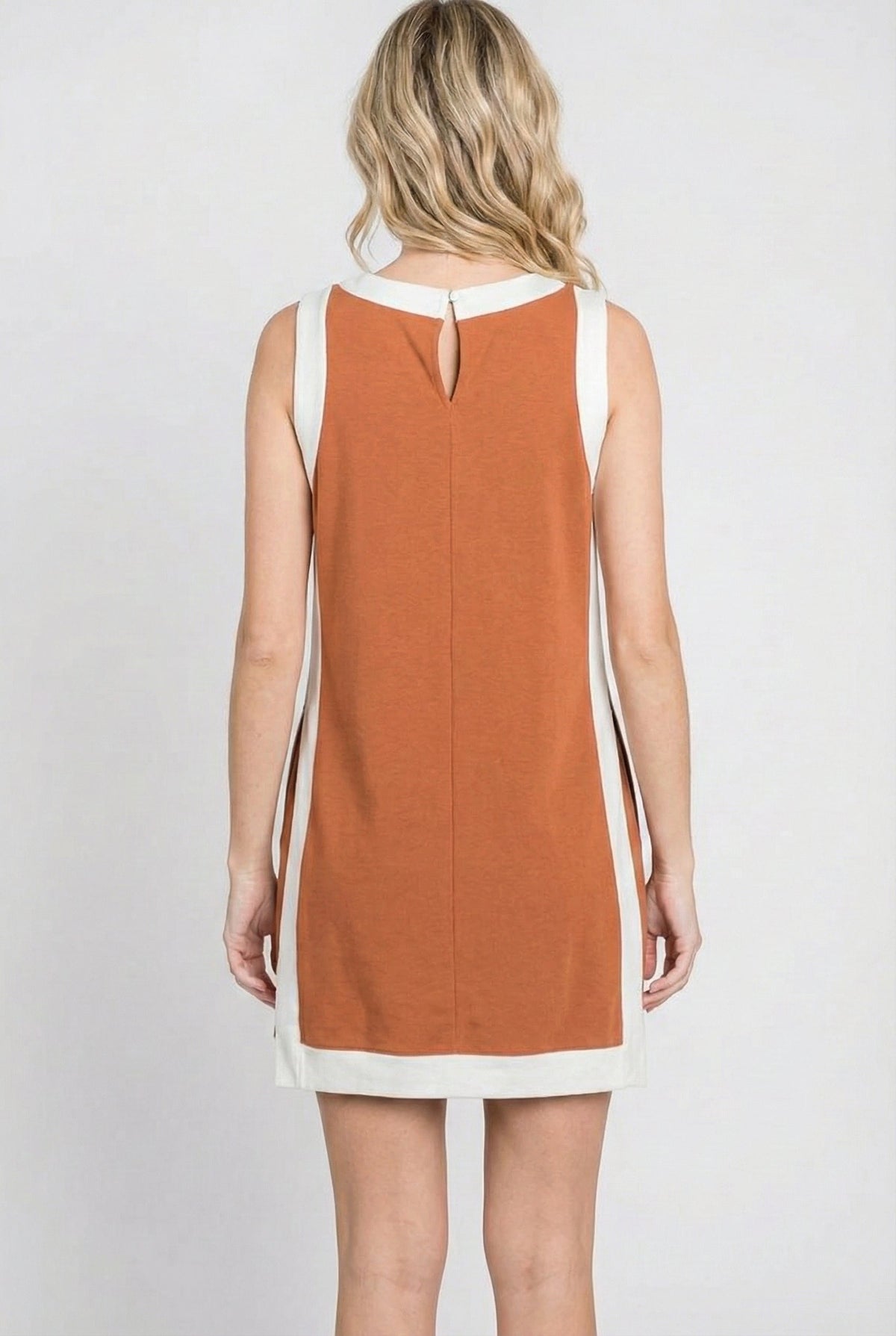Burnt orange sleeveless tunic dress set with white-trim hem and keyhole back