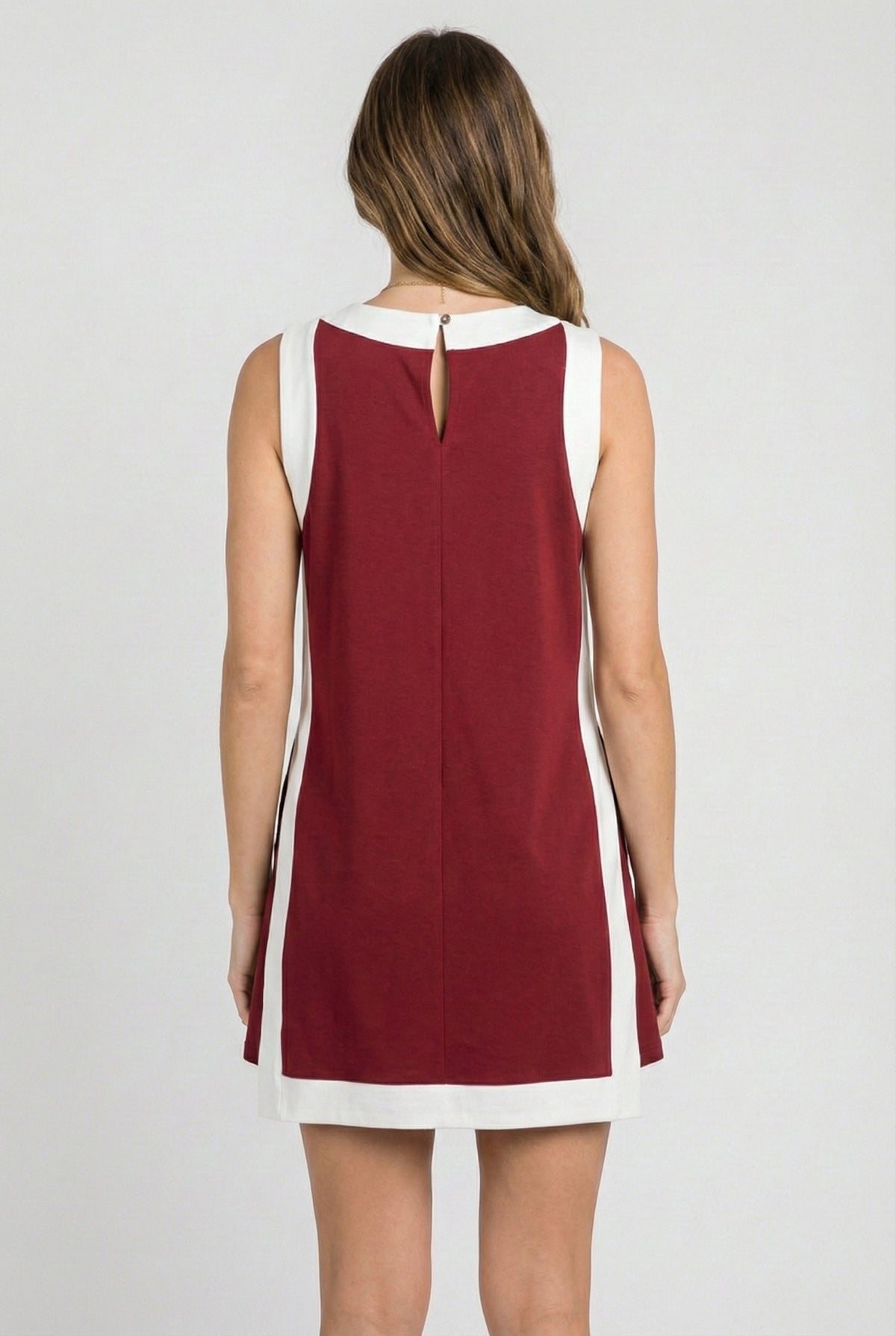 Crimson sleeveless dress back view with white side stripes and keyhole notch