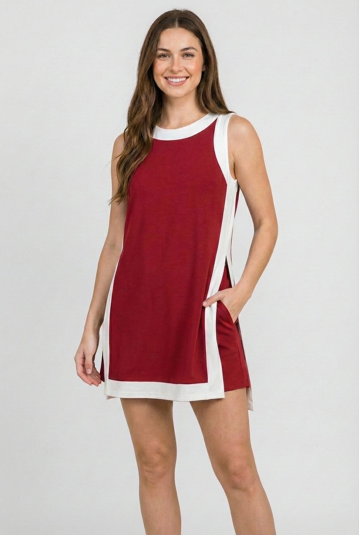 Crimson sleeveless dress with white side trim and crew neckline