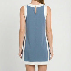 Back view of blue sleeveless tunic dress with white trim and keyhole neckline opening