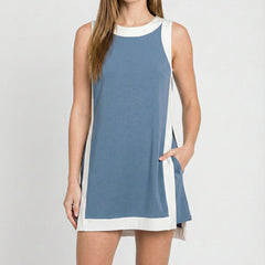 Sleeveless blue tunic dress with white crew neck trim and side panel accents