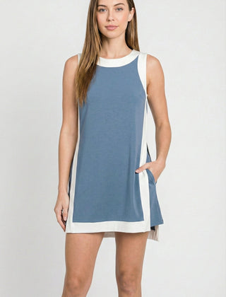 Sleeveless blue tunic dress with white crew neck trim and side panel accents