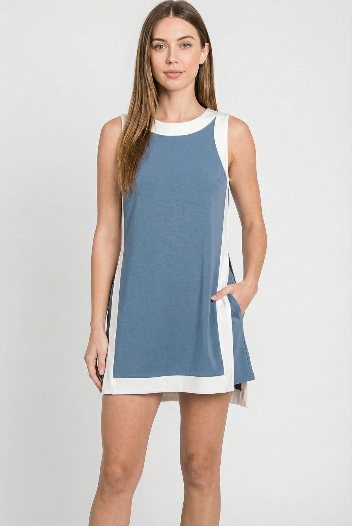 Sleeveless blue tunic dress with white crew neck trim and side panel accents