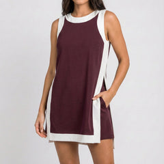 Maroon sleeveless dress with white trim, side slits, and crew neckline
