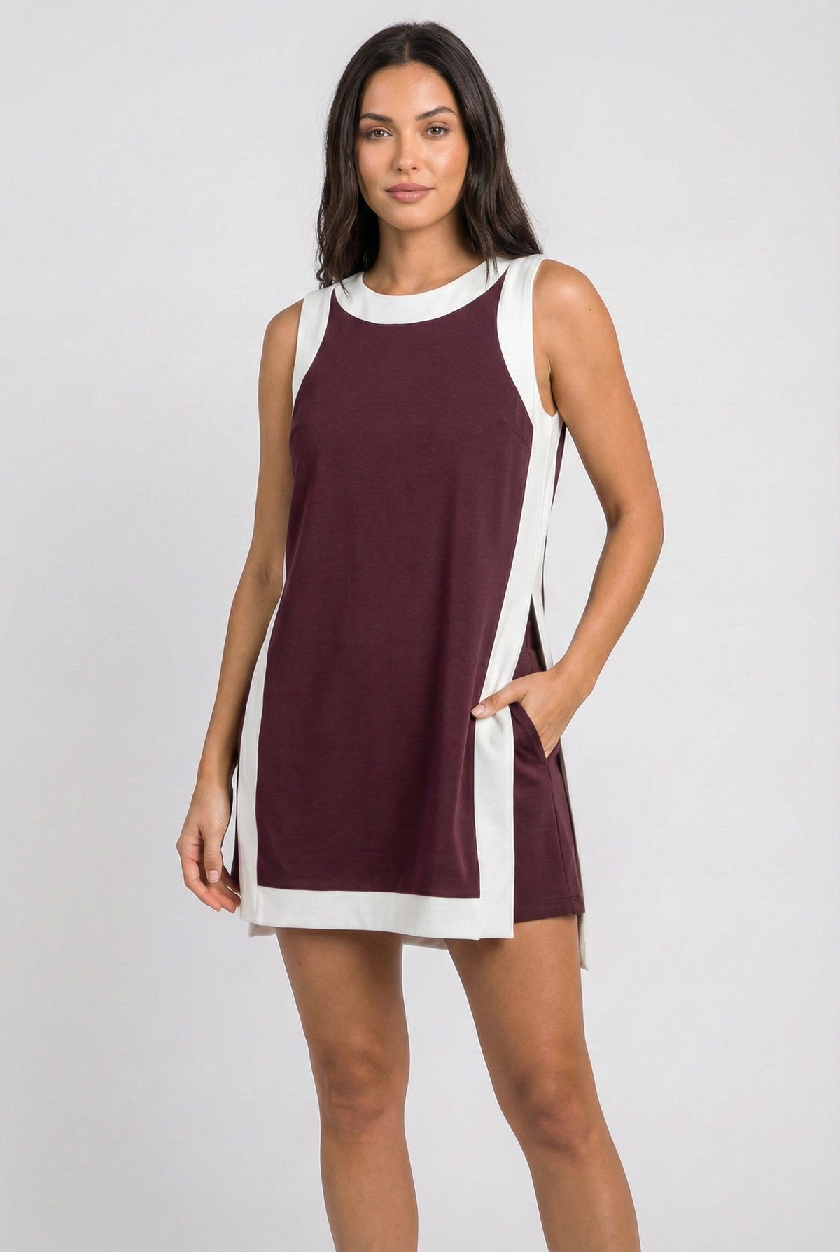 Maroon sleeveless dress with white trim, side slits, and crew neckline