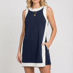 Sleeveless navy game day dress with white side panels and scoop neckline