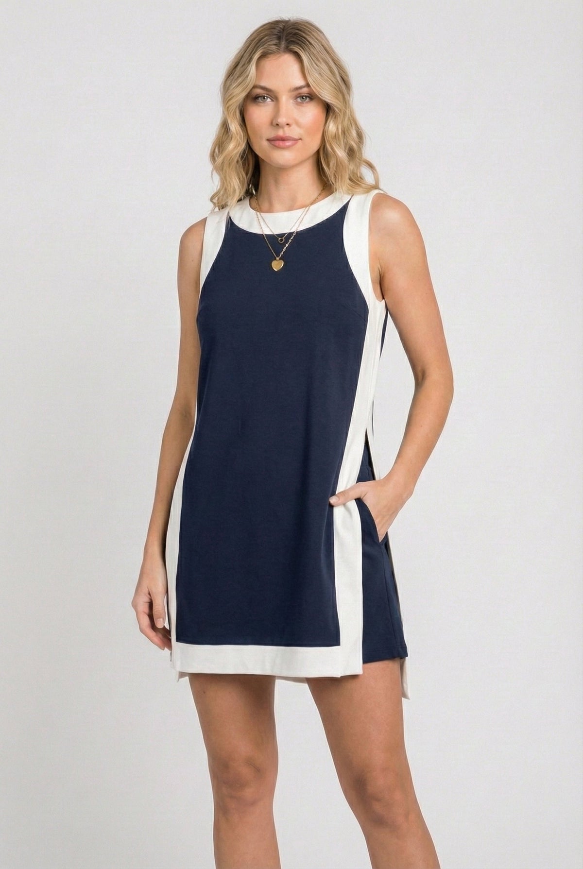 Sleeveless navy game day dress with white side panels and scoop neckline