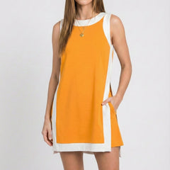 Orange sleeveless tunic dress with white crew neck, hem border, and side tie ribbon