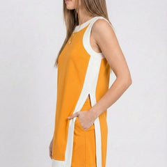 Orange sleeveless tunic dress in profile with white side stripes and hip tie ribbon
