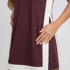 Maroon sleeveless dress with white hem trim and side panel detail