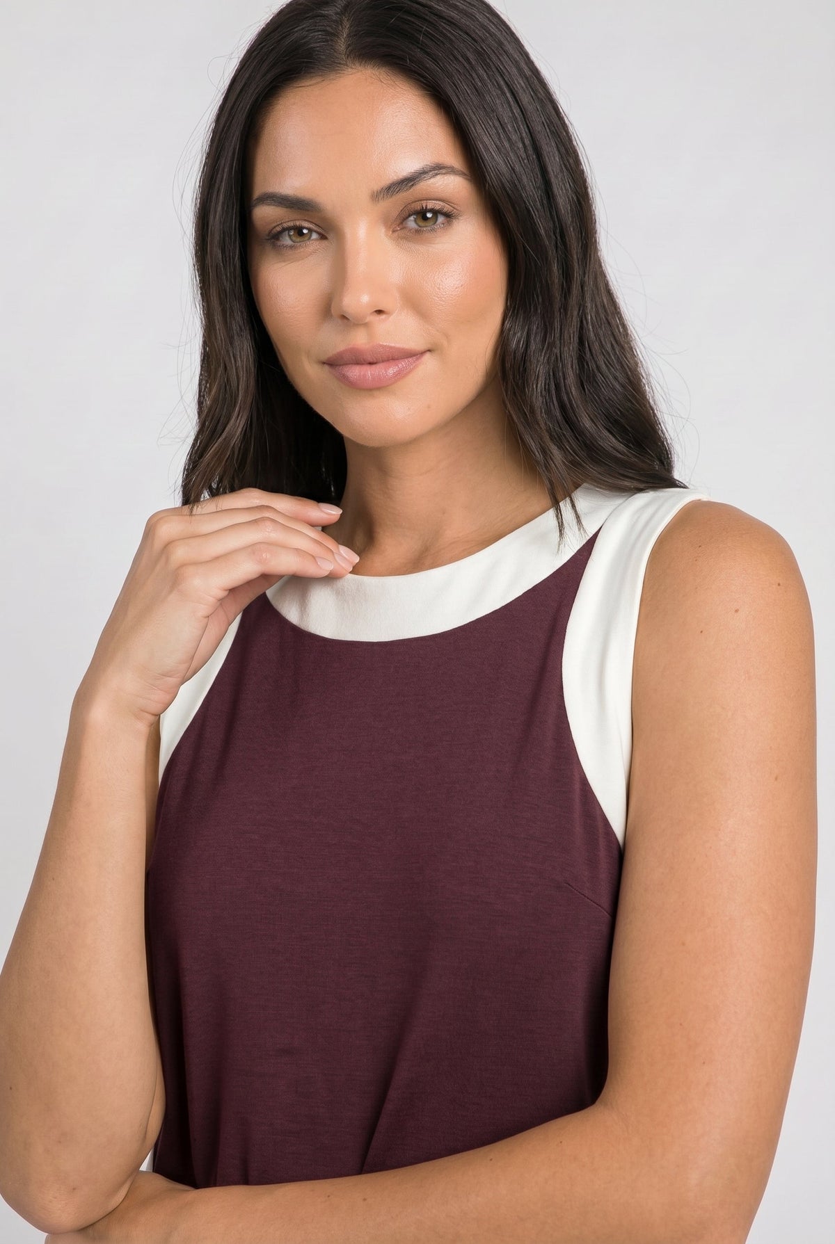 Maroon sleeveless dress with white crew neck and armhole trim