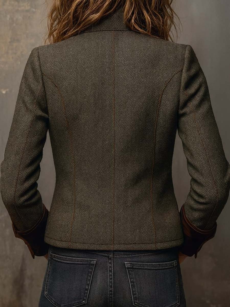 Olive herringbone jacket back view with structured seams and long sleeves