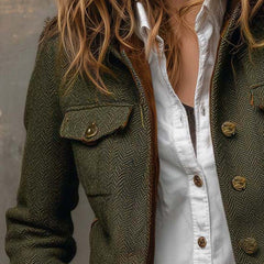 Olive herringbone jacket with flap chest pocket, gold-tone buttons, and open collar