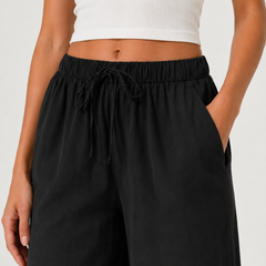 Brennan pants in black, close-up elastic waist with gathered drawstring detail