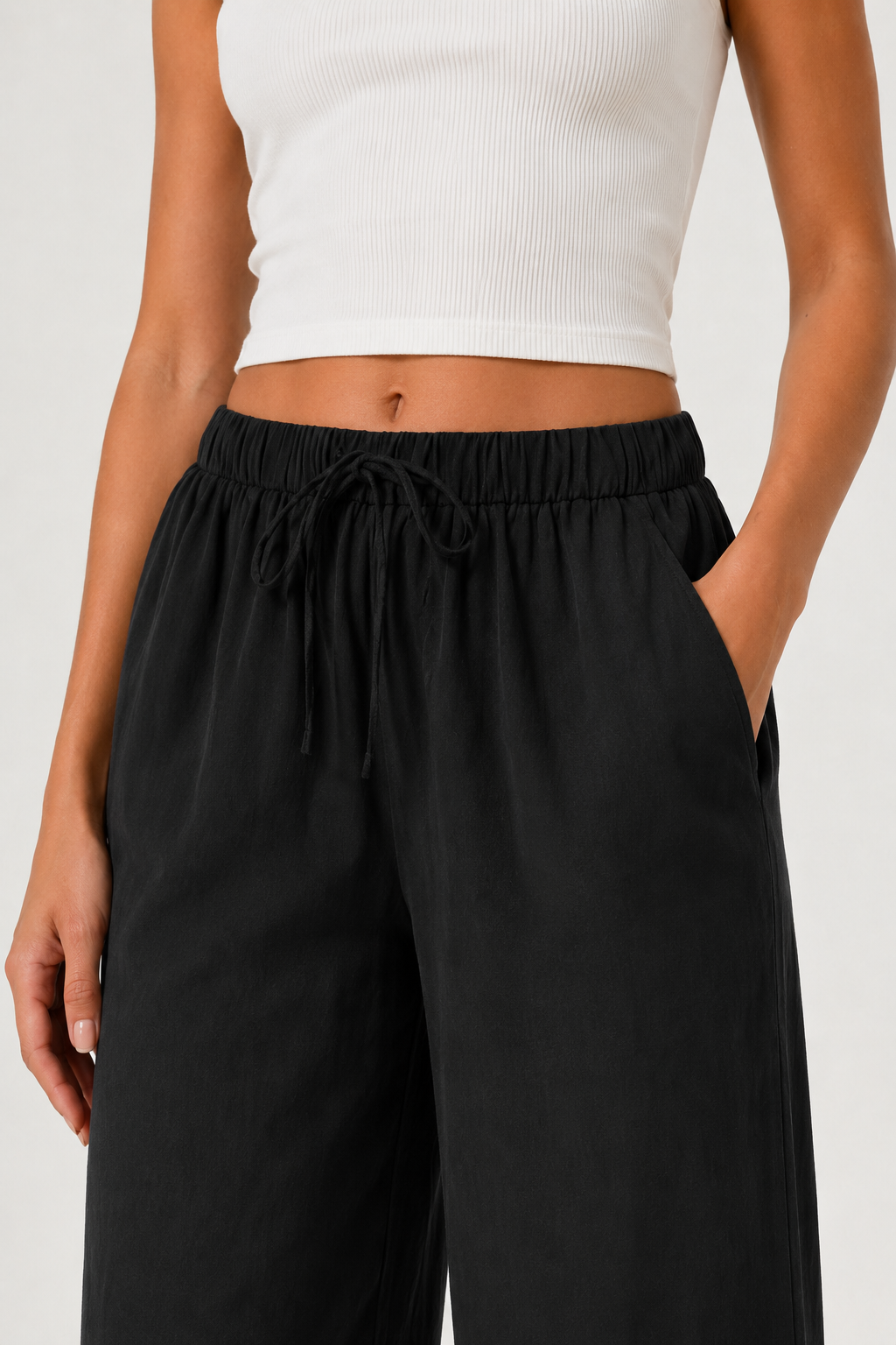 Brennan pants in black, close-up elastic waist with gathered drawstring detail