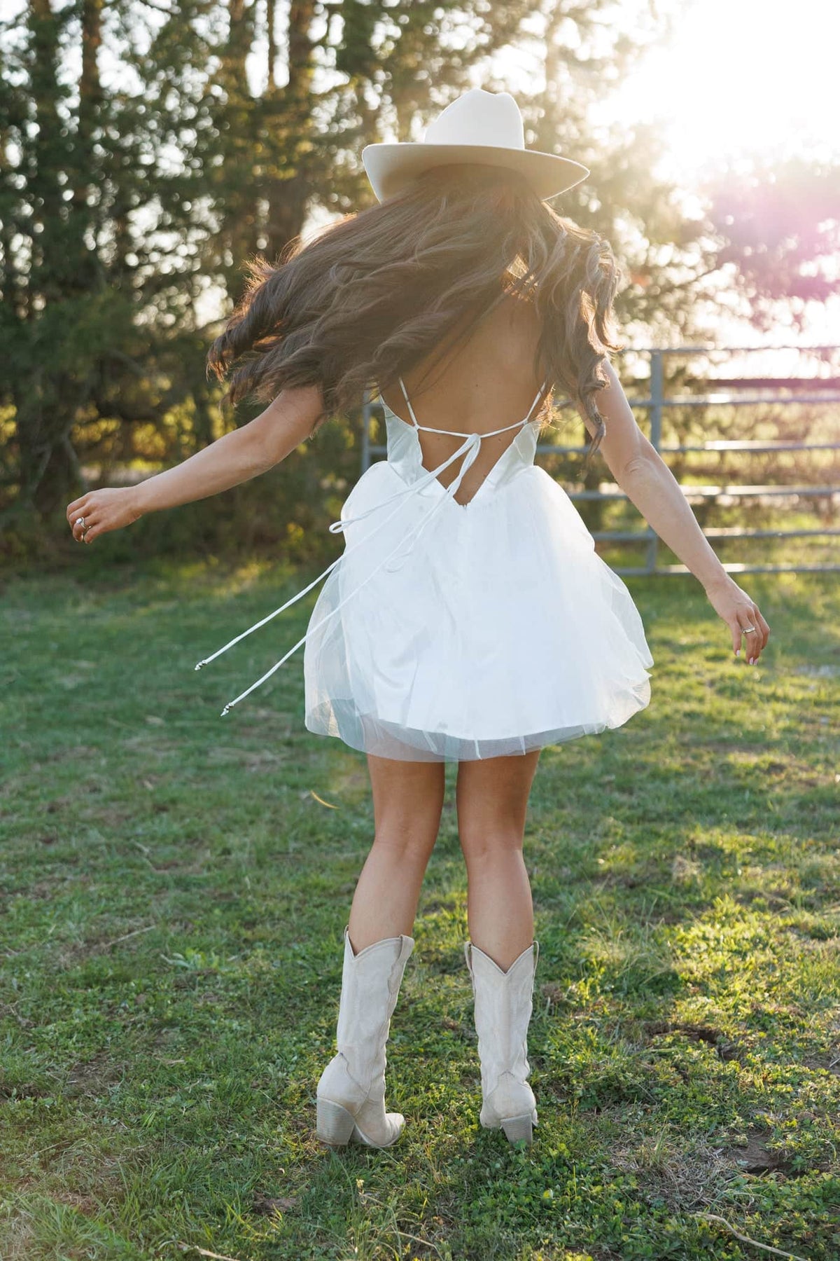 White backless tulle dress with thin crisscross straps