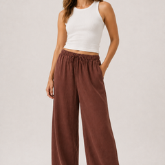 Brennan pants in spiced cognac brown, wide-leg with elastic drawstring waist.