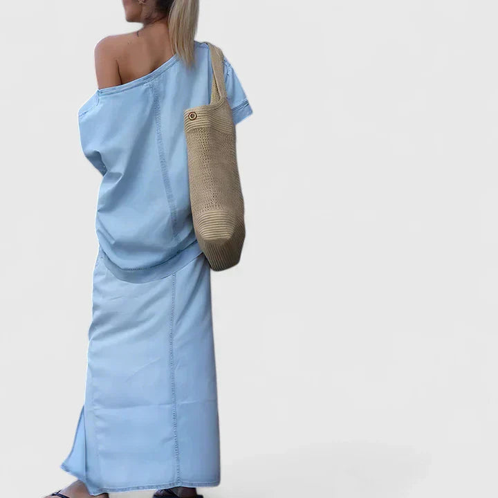 Blue denim maxi skirt set with one-shoulder draped top and side-slit maxi skirt