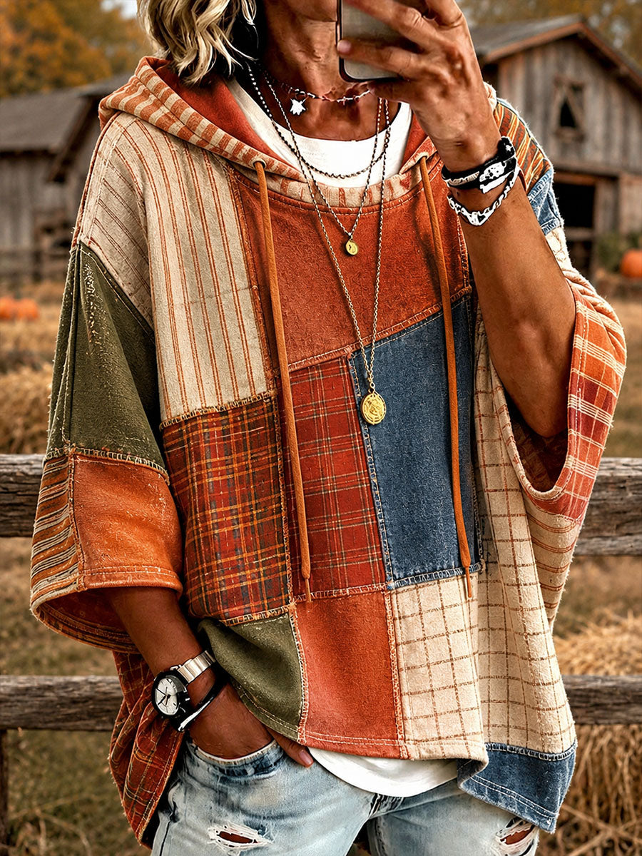 Oversized patchwork hoodie with plaid panels in orange, blue, and cream, front pocket