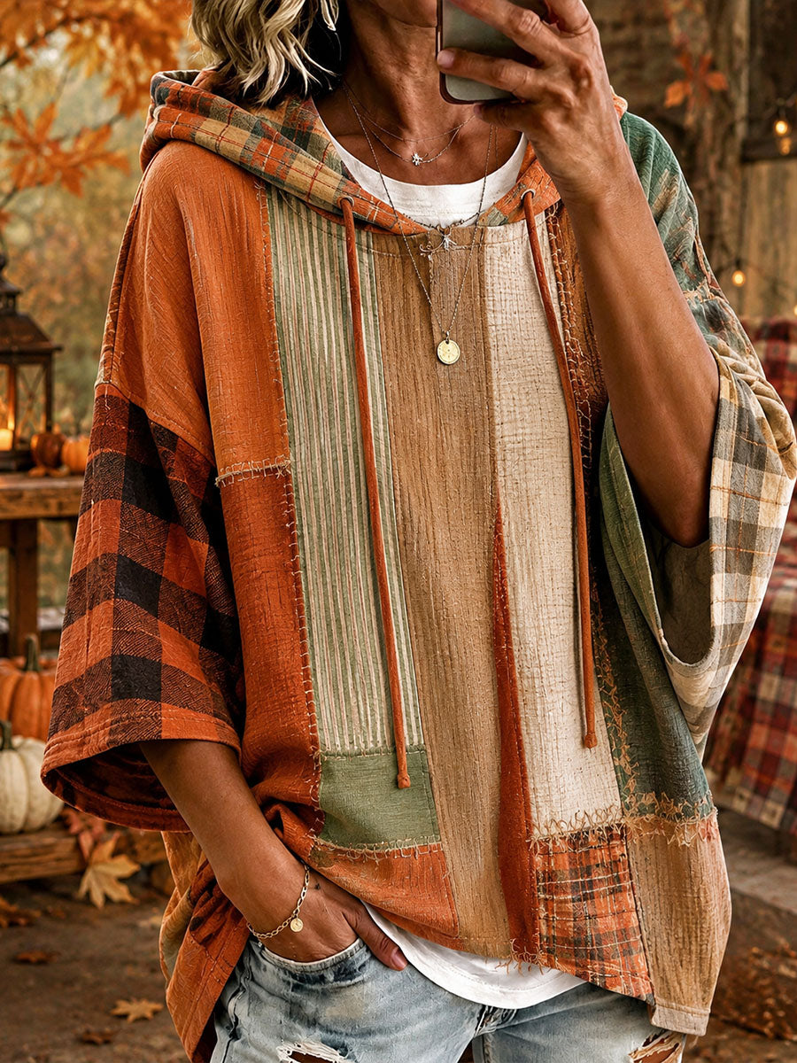 Oversized patchwork hoodie with hood, autumn-toned striped and plaid panels, long sleeves