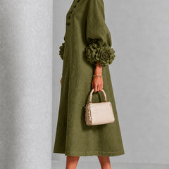 Olive midi dress with side profile, button front and large rosette puff cuffs