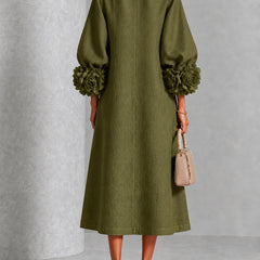 Olive midi dress back view with button placket and rosette puff sleeve cuffs