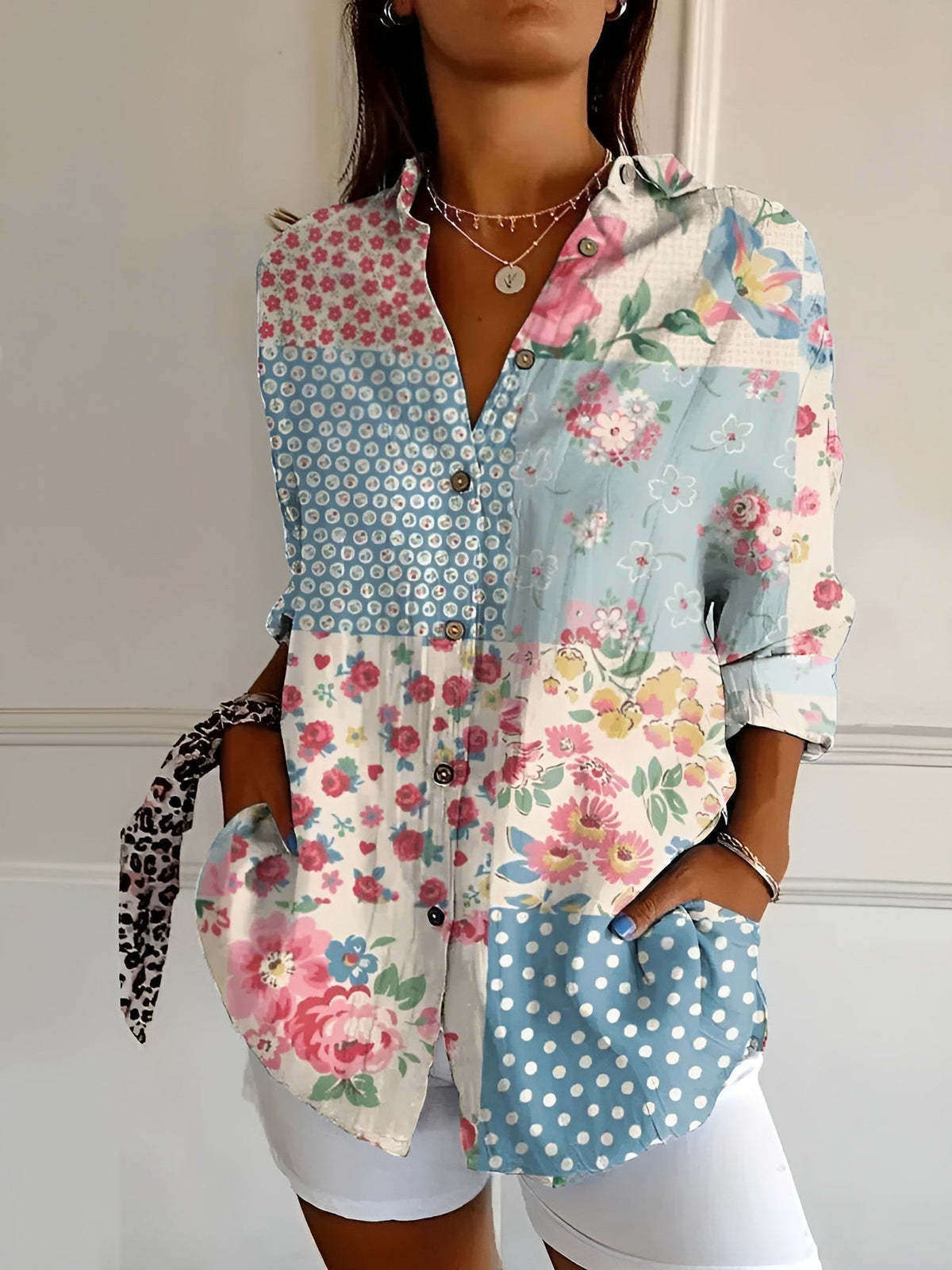 Floral patchwork summer blouse with button front, collared V-neck, and rolled sleeves