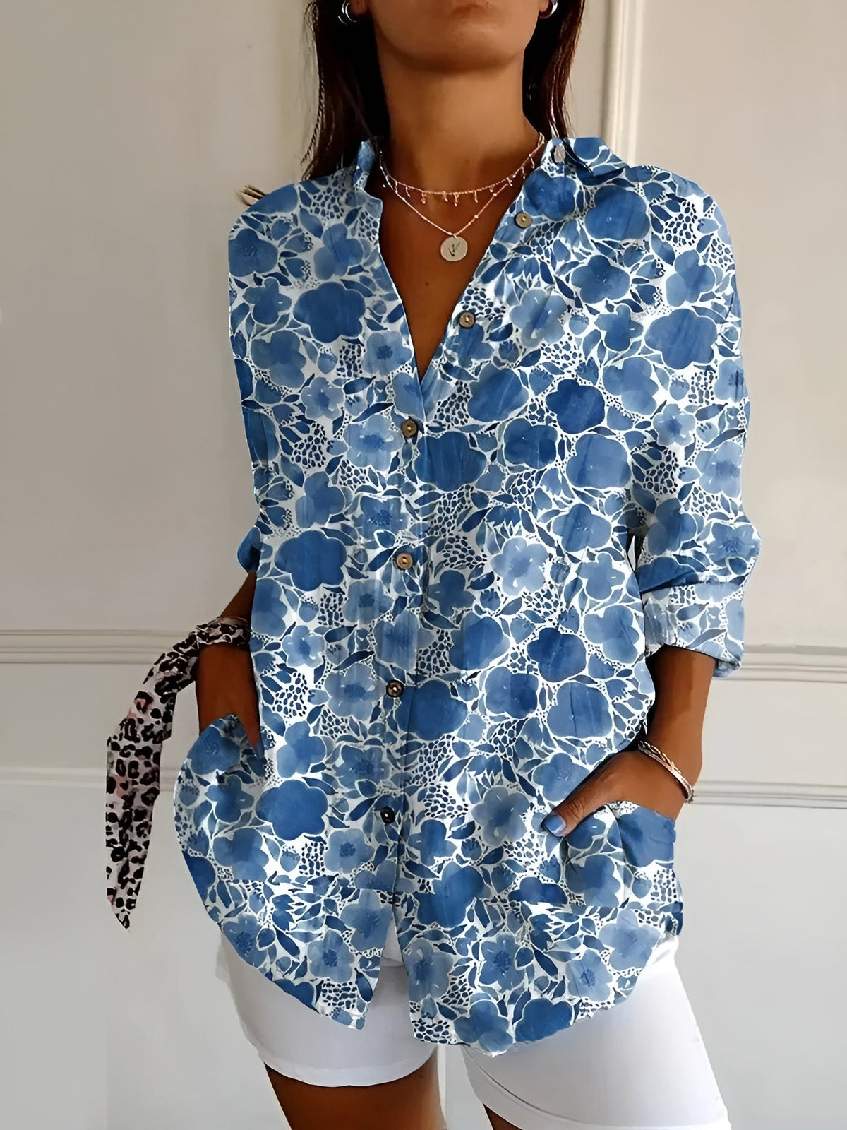 Blue floral lace print summer blouse with button front, collared V-neck, rolled sleeves