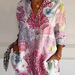 Pink and purple coral print summer blouse with button front, collared V-neck, rolled sleeves