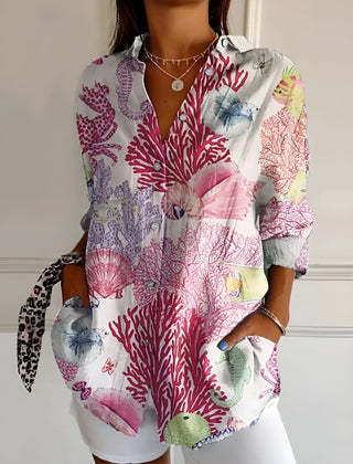 Pink and purple coral print summer blouse with button front, collared V-neck, rolled sleeves