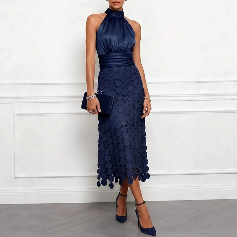 Navy halter neck midi dress with scalloped scale pattern and high gathered neckline