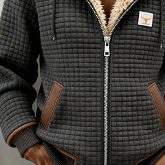 Sherpa-lined quilted zip-up hooded jacket, dark gray with tan flap pockets and ribbed cuffs