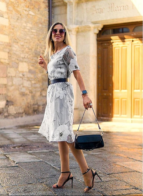 Gray floral midi dress with cinched waist, short sleeves, A-line hem