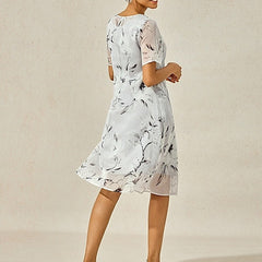 Gray floral midi dress from side view, short puff sleeves, flared A-line skirt
