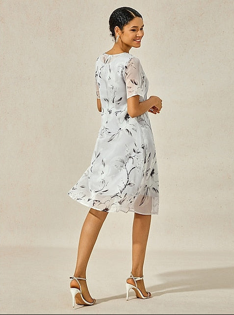 Gray floral midi dress from side view, short puff sleeves, flared A-line skirt