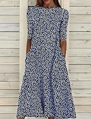 Coastal Bloom dress in dark blue with white small floral pattern, short sleeves
