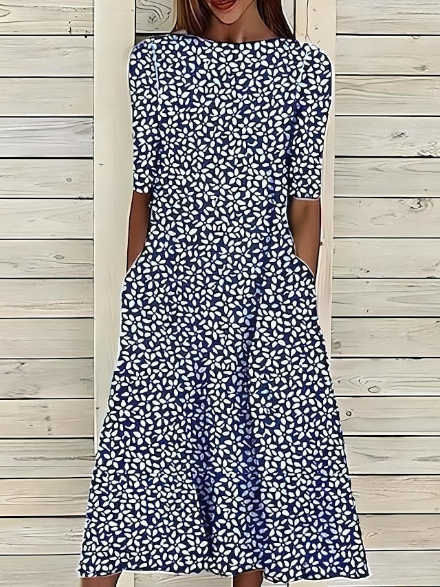 Coastal Bloom dress in dark blue with white small floral pattern, short sleeves